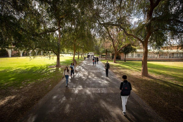 Students walk the campus between Rivera Library, left, and Watkins Hall on January 17, 2020. 