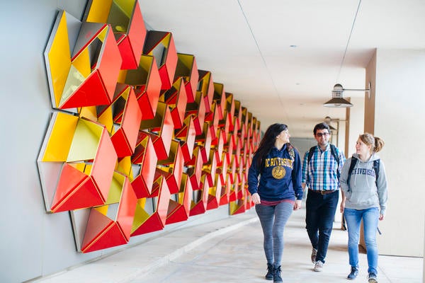 UCR students walking near Genomics building