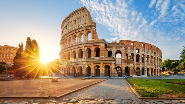 Sunburst near the historic Collosseum in Rome, Italy