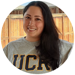 photo of Geraldine Lopez, a UCR student with dark hair, smiling at the camera