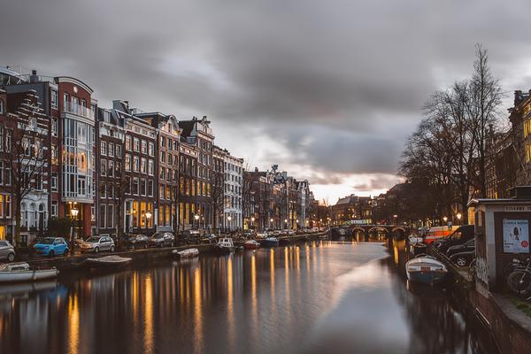 Photo of Amsterdam canal at dusk