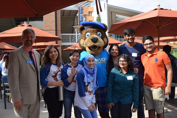Group of UCR students with Scotty Bear at international student orientation