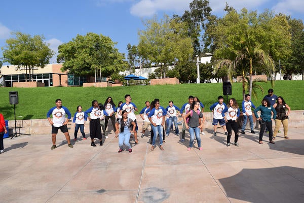 Group of UCR students dancing at orientation