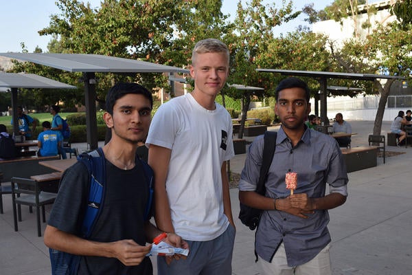 3 male UCR students at international student orientation