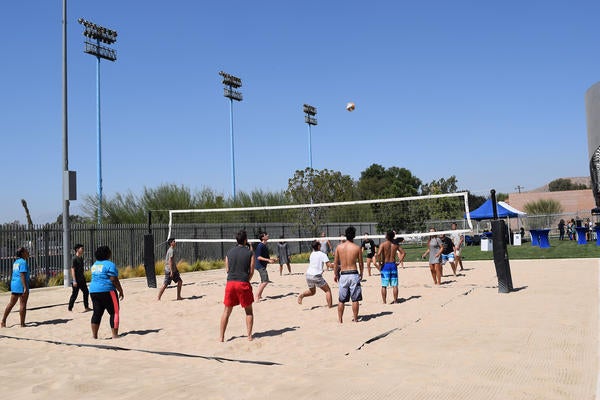 International students playing volleyball during orientation