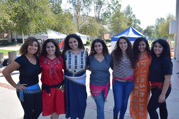 Group of female students posing after bellydancing routine