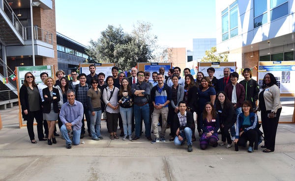 Large group of international scholars at UCR research poster fair