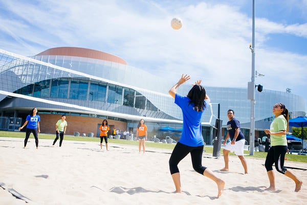 UCR students playing volleyball at the SRC