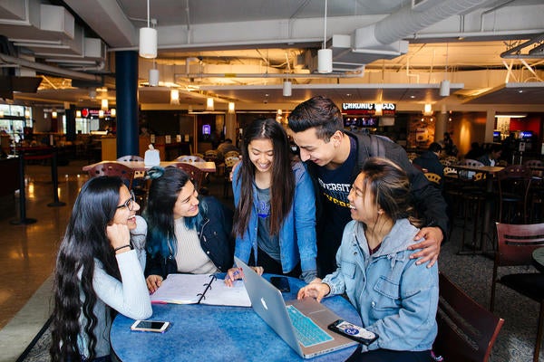 UCR students studying in HUB dining area