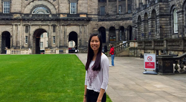 UCR student standing in front of University of Edinburgh